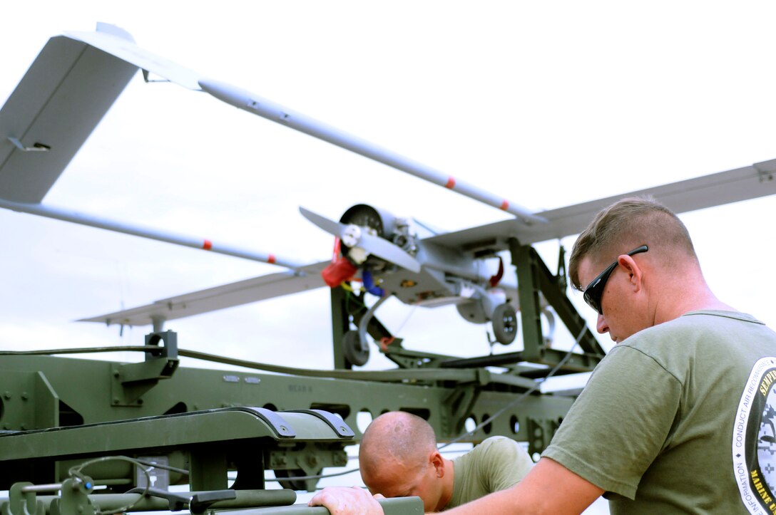 Sgt. Justin Wardlow, 27 from Carbondale, Pa., Marine Unmanned Aerial Vehicle Squadron 4 unmanned aircraft mechanic, prepares the launcher for an RQ-7B Shadow unmanned aircraft before the squadron’s inaugural flight at Auxiliary Airfield 2 in Yuma, Ariz., Sept. 28, 2010. During the flight, the squadron showcased the aircraft’s reconnaissance and surveillance capabilities with a live video feed from the Shadow’s onboard camera. The Yuma detachment of the Texas-based reserve squadron is the only operational component of the unit and is composed of mostly active duty Marines. The detachment, which began assembling at the Marine Corps Air Station in Yuma, Ariz., in June, has four Shadows and consists of approximately 40 Marines.