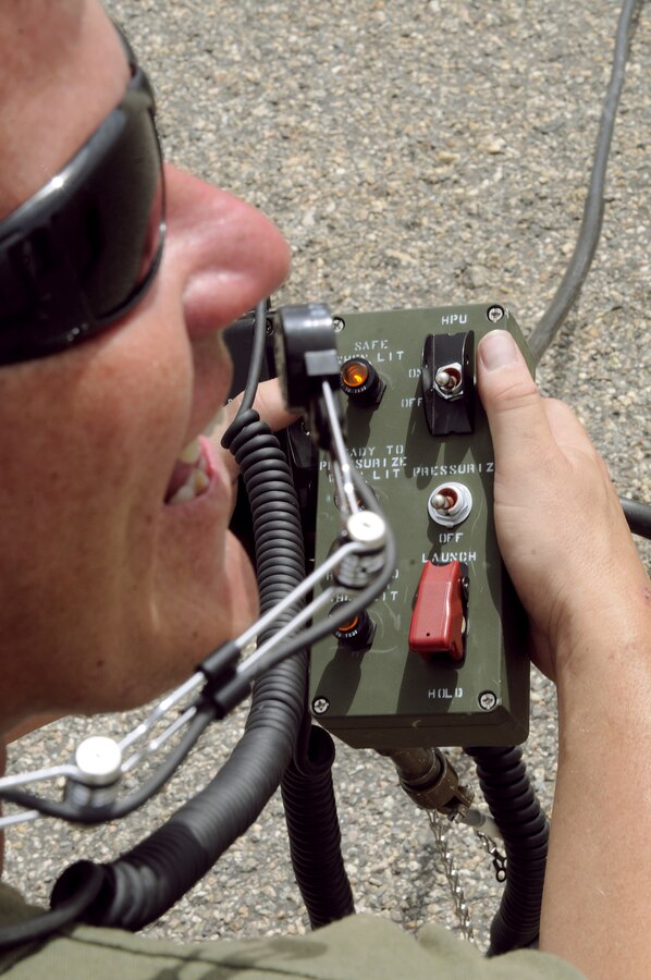 Sgt. Justin Wardlow, 27 from Carbondale, Pa., Marine Unmanned Aerial Vehicle Squadron 4 unmanned aircraft mechanic, prepares to flip the switch that will launch an RQ-7B Shadow unmanned aircraft for the squadron’s inaugural flight at Auxiliary Airfield 2 in Yuma, Ariz., Sept. 28, 2010. During the flight, the squadron showcased the aircraft’s reconnaissance and surveillance capabilities with a live video feed from the Shadow’s onboard camera. The Yuma detachment of the Texas-based reserve squadron is the only operational component of the unit and is composed of mostly active duty Marines. The detachment, which began assembling in Yuma in June, has four Shadows and consists of approximately 40 Marines.