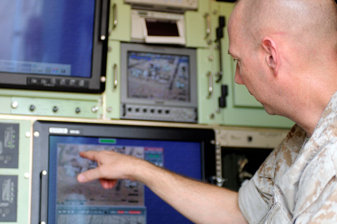 Col. Peter Yeager, commanding officer of Marine Air Control Group 48, which is the parent command for Marine Unmanned Aerial Vehicle Squadron 4, inquires about the RQ-7B Shadow unmanned aircraft while watching its live video feed during the squadron’s inaugural flight at Auxiliary Airfield 2 in Yuma, Ariz., Sept. 28, 2010. The Yuma detachment of the Texas-based reserve squadron is the only operational component of the unit and is composed of mostly active duty Marines. The detachment, which began assembling in Yuma in June, has four Shadows and consists of approximately 40 Marines. “It’s a big deal,” said Yeager. “This is the first unmanned aircraft squadron in the 4th Marine Aircraft Wing and in the reserves.”