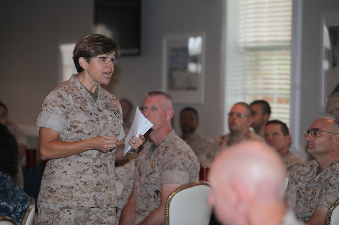 Rear Adm. Margaret Kibben (left), the 18th chaplain of the Marine Corps and the deputy chief of Navy chaplains, speaks to chaplains and religious program specialists during a luncheon at the Ball Center aboard Marine Corps Base Camp Lejeune, recently.  Kibben is the first female chaplain of the Marine Corps.