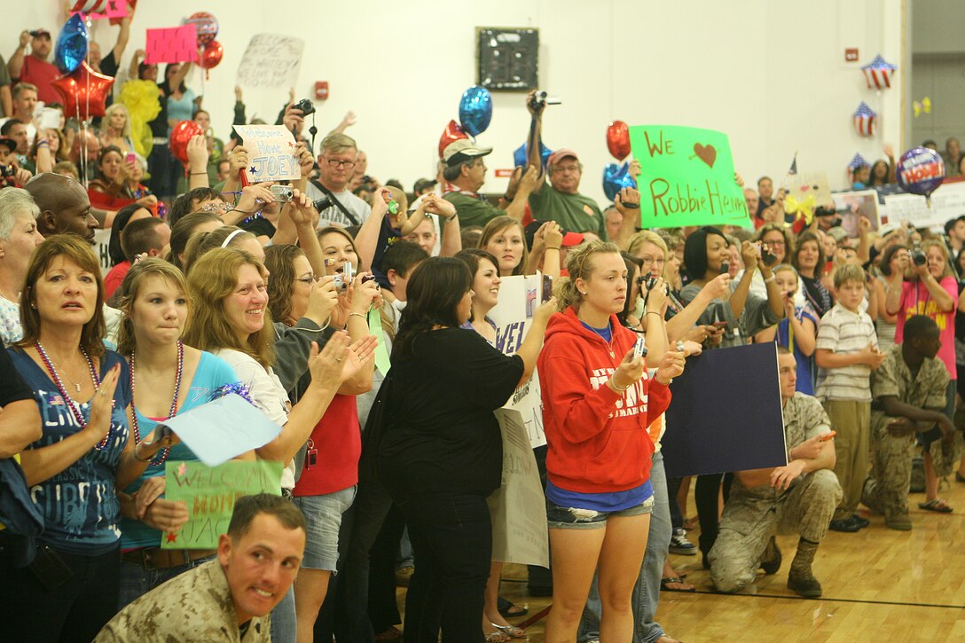 Family members of the Marines of 1st Battalion, 2nd Marine Regiment anxiously await the arrival of their Marines, Sept. 29, at the Area 1 gymnasium.  The unit returned from Helmand Province, Afghanistan, after a seven month deployment in support of counterinsurgency operations in the area.