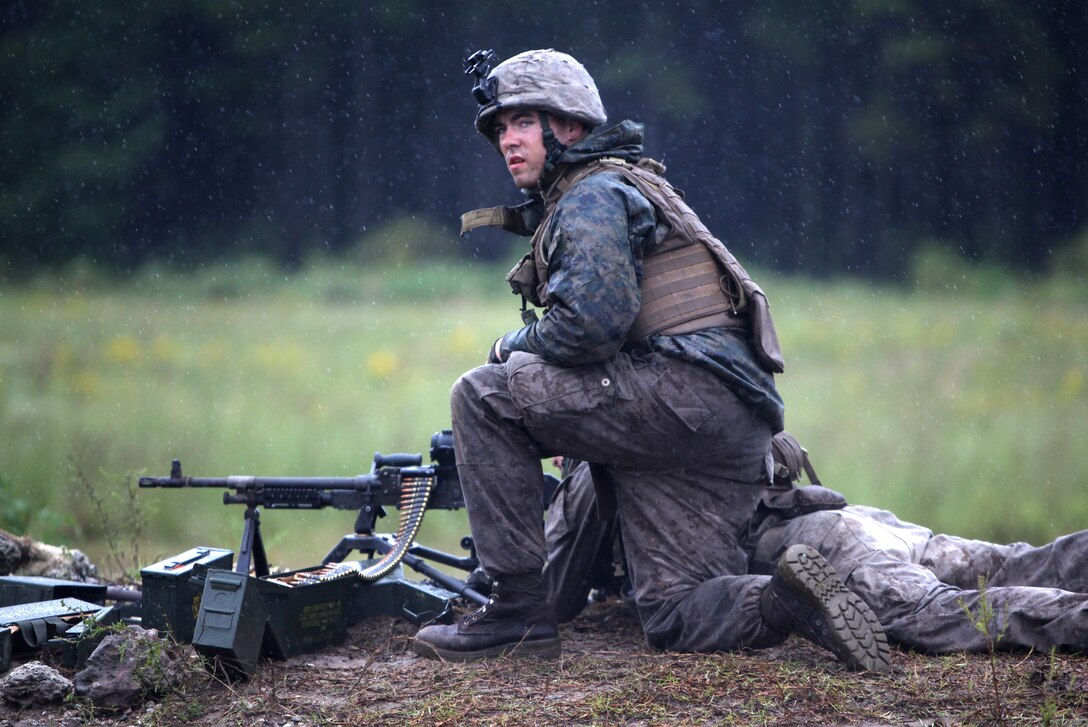 MARINE CORPS BASE CAMP LEJEUNE, N.C. - Lance Corporal Travis Pike, a machine gunner with Echo Company, 2nd Battalion, 2nd Marine Regiment and Groveland, Fla., native, participates in a live fire exercise aboard Camp Lejeune, N.C. Sept. 29, 2010. The battalion's gunners spent three days of the ten day field exercise advancing their machine gun skills by firing the M-240B medium machine gun in the rain.  Companies Echo, Fox and Golf, spent several rainy days reiterating and advancing machine gun skills by shooting the M-240B medium machine gun, the M-2 heavy machine gun and the MK-19 40mm automatic grenade launcher. (Official Marine Corps by Cpl. Justin M. Martinez)