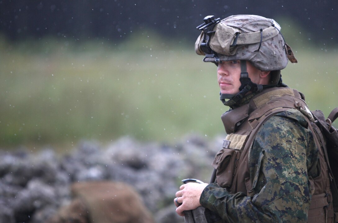 MARINE CORPS BASE CAMP LEJEUNE, N.C. - Lance Corporal Robert A. Bouchard, a machine gun squad leader with 2nd Battalion, 2nd Marine Regiment and Dothan, Ala., native, observes and directs the firing of M-240B medium machine gun gunners during a live fire exercise aboard Camp Lejeune, N.C., Sept 29, 2010. Bouchard, along with the battalion's machine gunners, conducted a ten day field exercise to advance the skill level of Marines. Companies Echo, Fox and Golf, spent several rainy days reiterating and advancing machine gun skills by shooting the M-240B medium machine gun, the M-2 heavy machine gun and the MK-19 40mm automatic grenade launcher. (Official Marine Corps by Cpl. Justin M. Martinez)