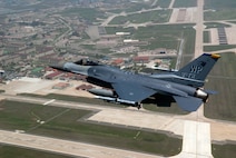 KUNSAN AIR BASE, Republic of Korea -- An 8th Fighter Wing F-16 Fighting Falcon flies over Kunsan Air Base in May 2010. The 8th FW zeroed out its flying hour program Sept. 30 for 2010. (U.S. Air Force photo/Master Sgt. Jason Wilkerson)