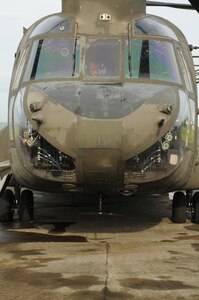 MANAGUA, Nicaragua --  Conducting a preflight inspection in the cockpit, Chief Warrant Officer Christopher Green, of the 1-228th Aviation Regiment, prepares a CH-47 Chinook helicopter for departure here Sept. 22. From Sept. 15-24,the 1-228th supported Operation Continuing Promise, which is a four-month humanitarian and civic assistance deployment. (U.S. Air Force photo/Tech. Sgt. Benjamin Rojek)