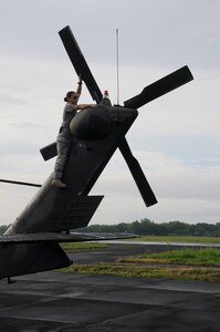 MANAGUA, Nicaragua --  Conducting a preflight inspection on the tail of a UH-60 Black Hawk, Chief Warrant Officer Denise Alonso, of the 1-228th Aviation Regiment, prepares the helicopter for departure Sept. 20 here. The 1-228th flew supplies and passengers to and from the USS Iwo Jima in support of Operation Continuing Promise from Sept. 15-24. (U.S. Air Force photo/Tech. Sgt. Benjamin Rojek)