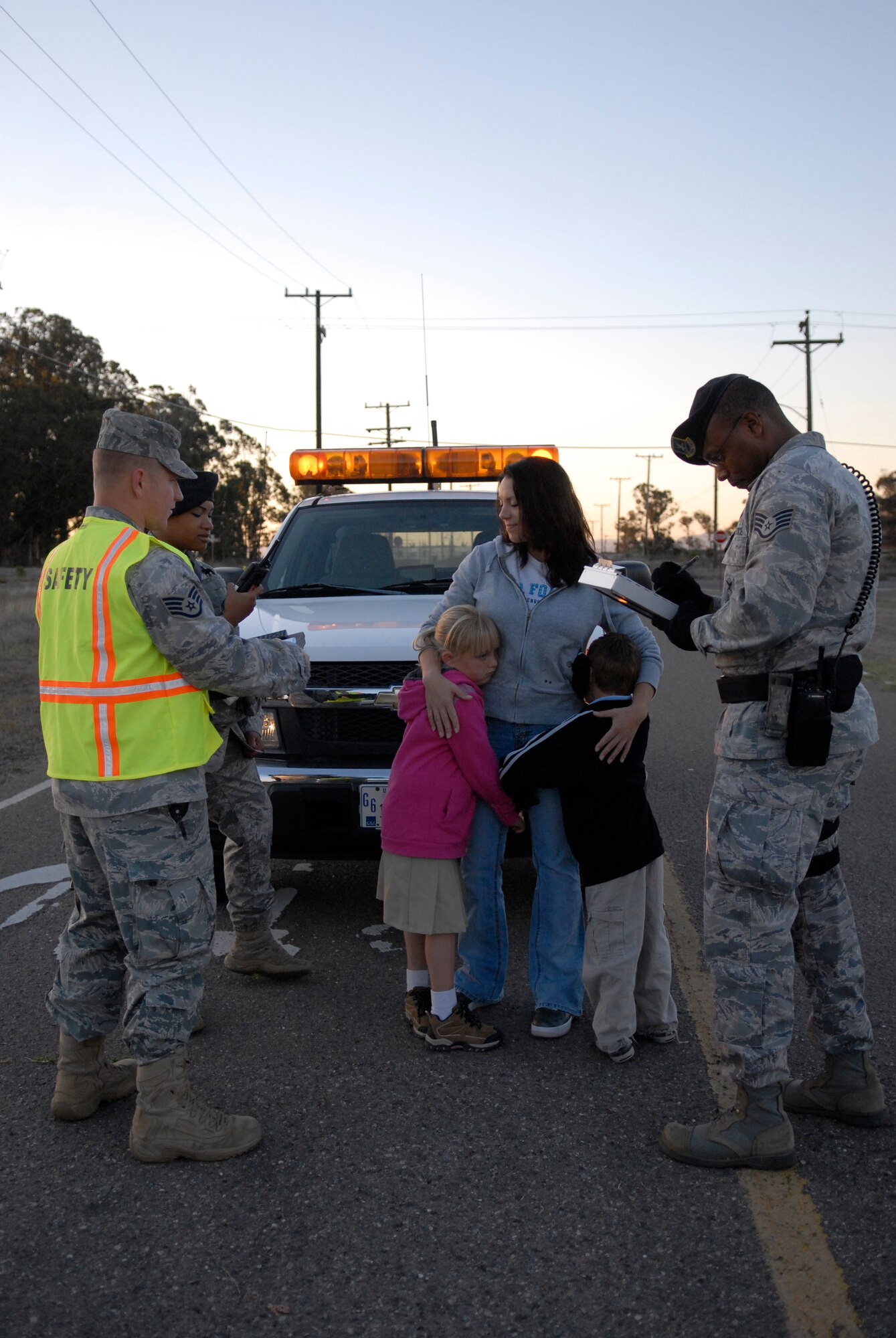 VANDENBERG AIR FORCE BASE, Calif. -- Jennifer Green and her children, Gillian and Max, act as the victims of a vehicle crash during a simulated accident scenario here Monday, Sept. 27, 2010. The scenario depicted an Airman texting while driving, which caused a major vehicle accident as the result of being distracted. (U.S. Air Force photo/Senior Airman Andrew Satran) 

 