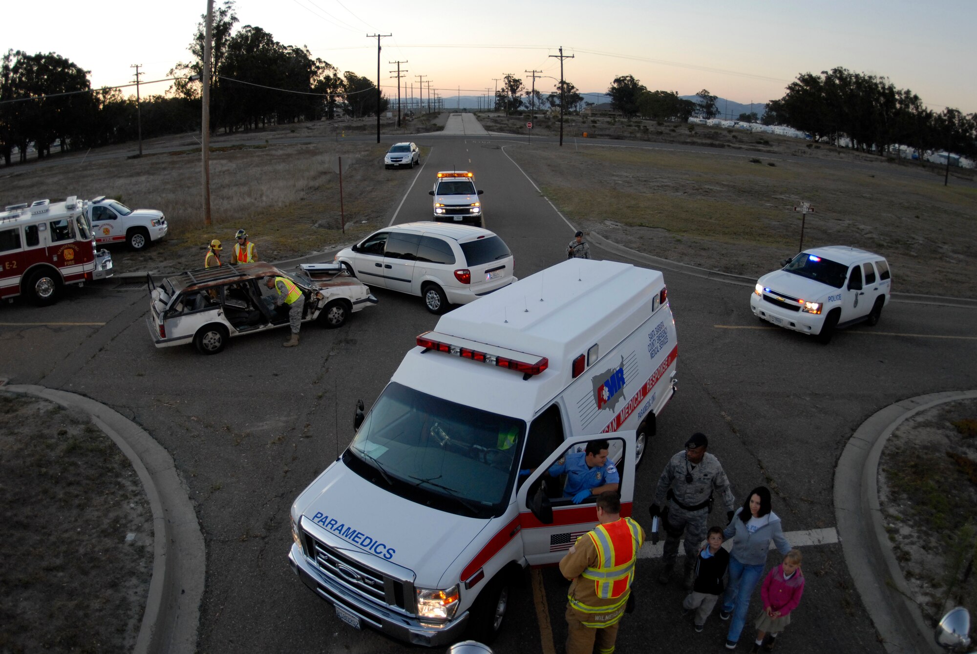 VANDENBERG AIR FORCE BASE, Calif. -- Emergency responders from the base assist an Airman in a simulated vehicle accident here Monday, Sept. 27, 2010. In 2008, 6,000 people were killed in accidents related to distracted driver incidences.  (U.S. Air Force photo/Senior Airman Andrew Satran) 