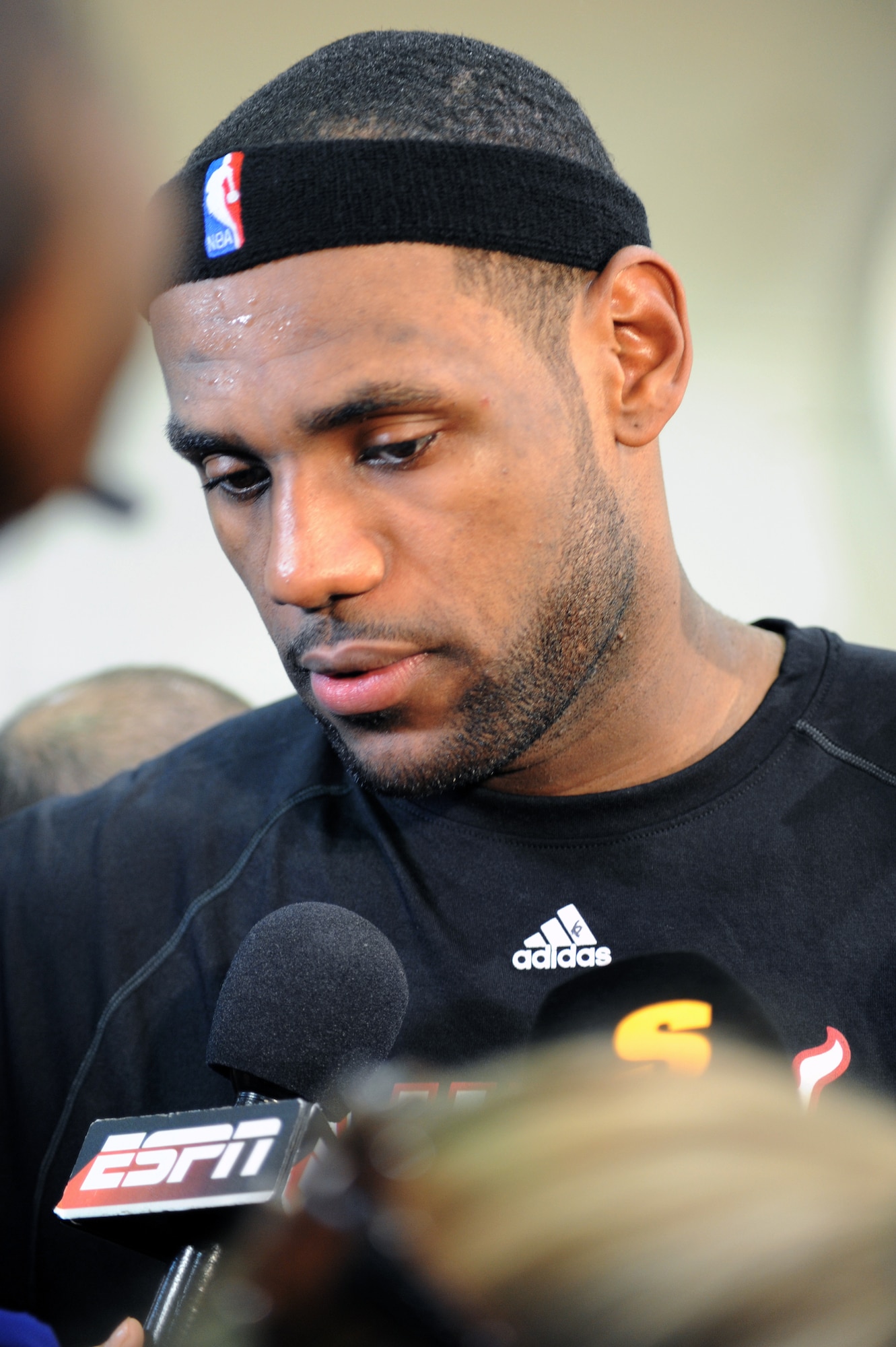NBA player LeBron James answers questions during a press conference after a preseason practice session Sept. 28, 2010, at the Aderholt Fitness Center at Hurlburt Field, Fla. The Miami Heat used the fitness center for their week-long training camp. James is a forward for the Heat. (U.S. Air Force photo/Senior Airman Sheila deVera)