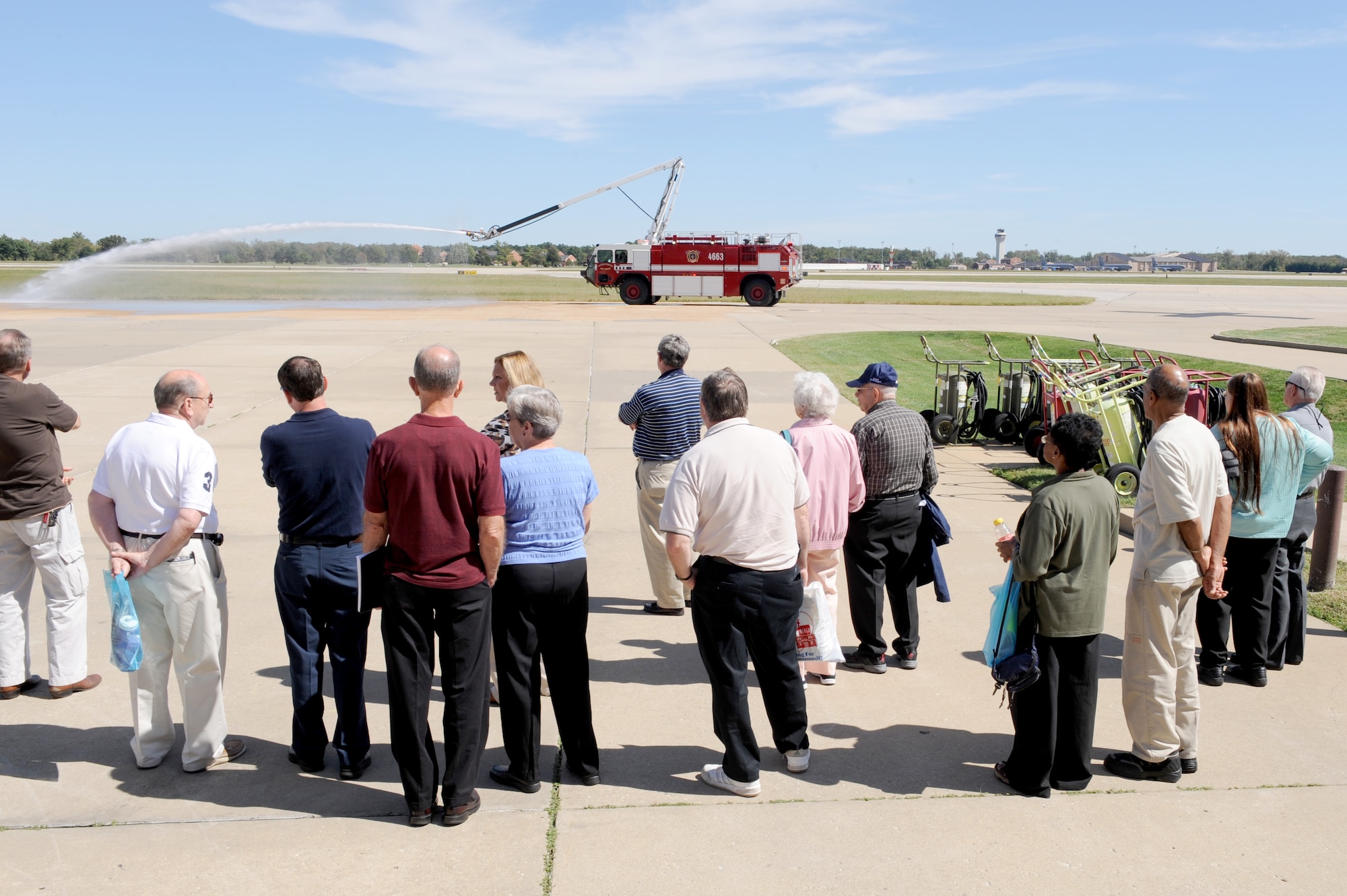 SCOTT AIR FORCE BASE, Ill. -- Retirees get a glimpse of the capabilities of one of the fire department vehicles used in emergency response during a base tour for Retiree Appreciation Day at Scott AFB, Sept. 25, 2010. The tour also consisted of a military working dog demonstration and a viewing of the C-21 aircraft. (U.S. Air Force photo by Staff Sgt. Brian J. Valencia)