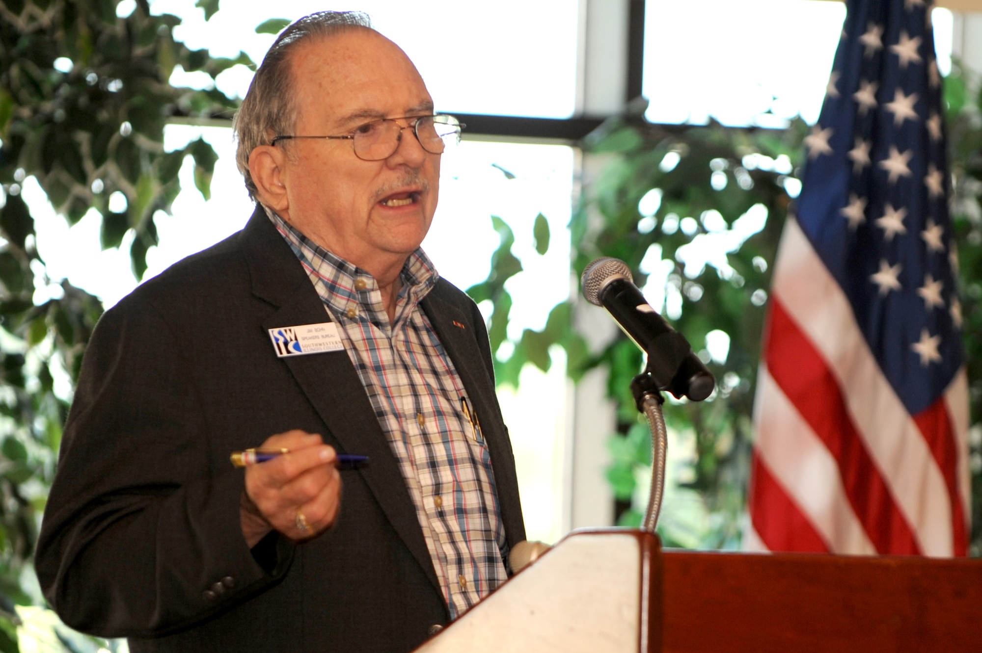 SCOTT AIR FORCE BASE, Ill. -- Retired Col. James Bohn, guest speaker, talks to attendees during Retiree Appreciation Day at the Scott AFB club, Sept. 25, 2010. At the event, retirees received valuable information about services available to them and were also invited on a base tour where they were able to see the fire department, a working dog demonstration and view the C-21 aircraft. (U.S. Air Force photo by Staff Sgt. Brian J. Valencia)