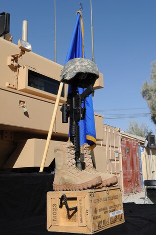 KANDAHAR, Afghanistan-- A memorial for 23-year-old Senior Airman Michael J. Buras, an Explosive Ordinance Disposal journeyman deployed from the 99th Civil Engineer Squadron, Nellis Air Force Base, Nev., stands at Camp Myers Kandahar Airfield, Afghanistan Sept. 27. Airman Buras died Sept. 21 of wounds suffered from an improvised explosive device detonation.  (U.S Air Force photo by Staff Sgt Taylor Worley)
