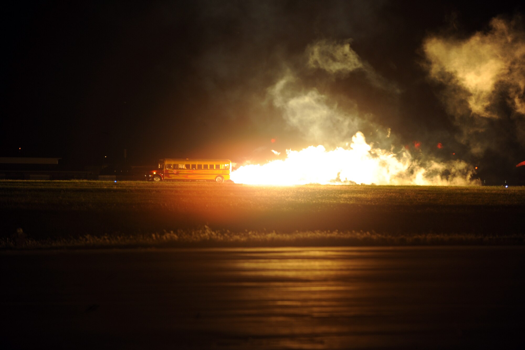 Paul Stender, jet-powered vehicle designer, performs in his jet-powered school bus at McConnell’s 2010 Open House and Air Show, Sept. 25, 2010, McConnell Air Force Base, Kan.  Stender’s performances at the air show included a jet-powered outhouse and a school bus, which traveled down the runway at speeds more than 300 mph. (U.S. Air Force photo/Staff Sgt. Dallas Edwards)