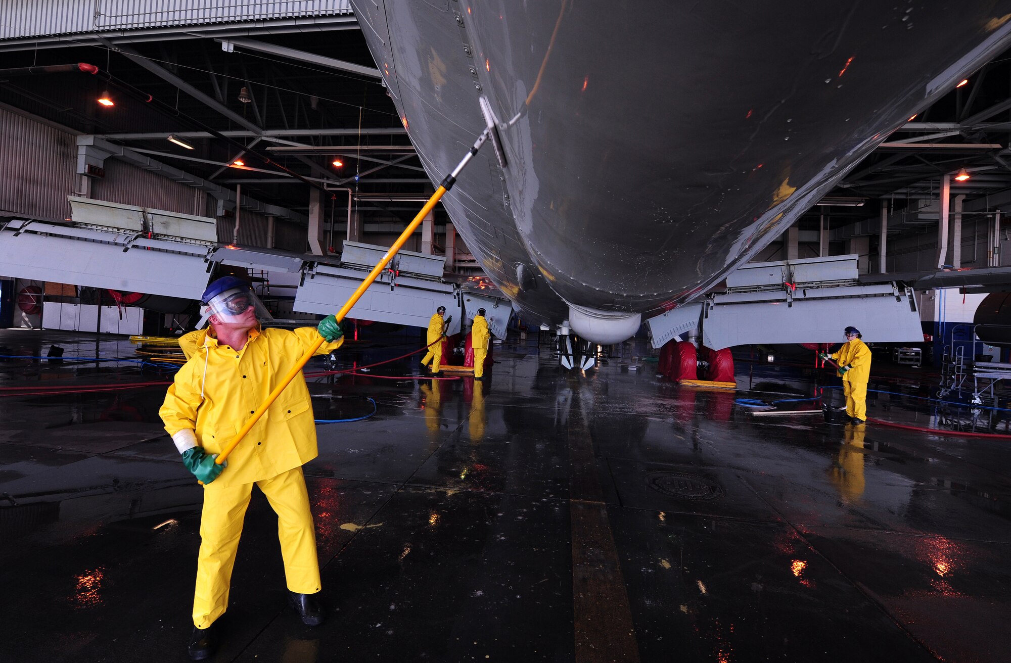 OFFUTT AIR FORCE BASE, Neb. - Airman 1st Class Rick Wrestler, of the 55th Aircraft Maintenance Squadron, scrubs the tail end of an RC-135V Rivet Joint aircraft inside hangar five of the Bennie Davis Maintenance Facility, Sept. 28.  Roughly ten crew chiefs assigned to the 55th Aircraft Maintenance Squadron perform routine cleanings of the airframes which often take up to eight hours to accomplish. The cleanings are part of a minor corrosion and control inspection which is followed by a full lubrication of the entire aircraft once cleaned. U.S. Air Force photo by Josh Plueger