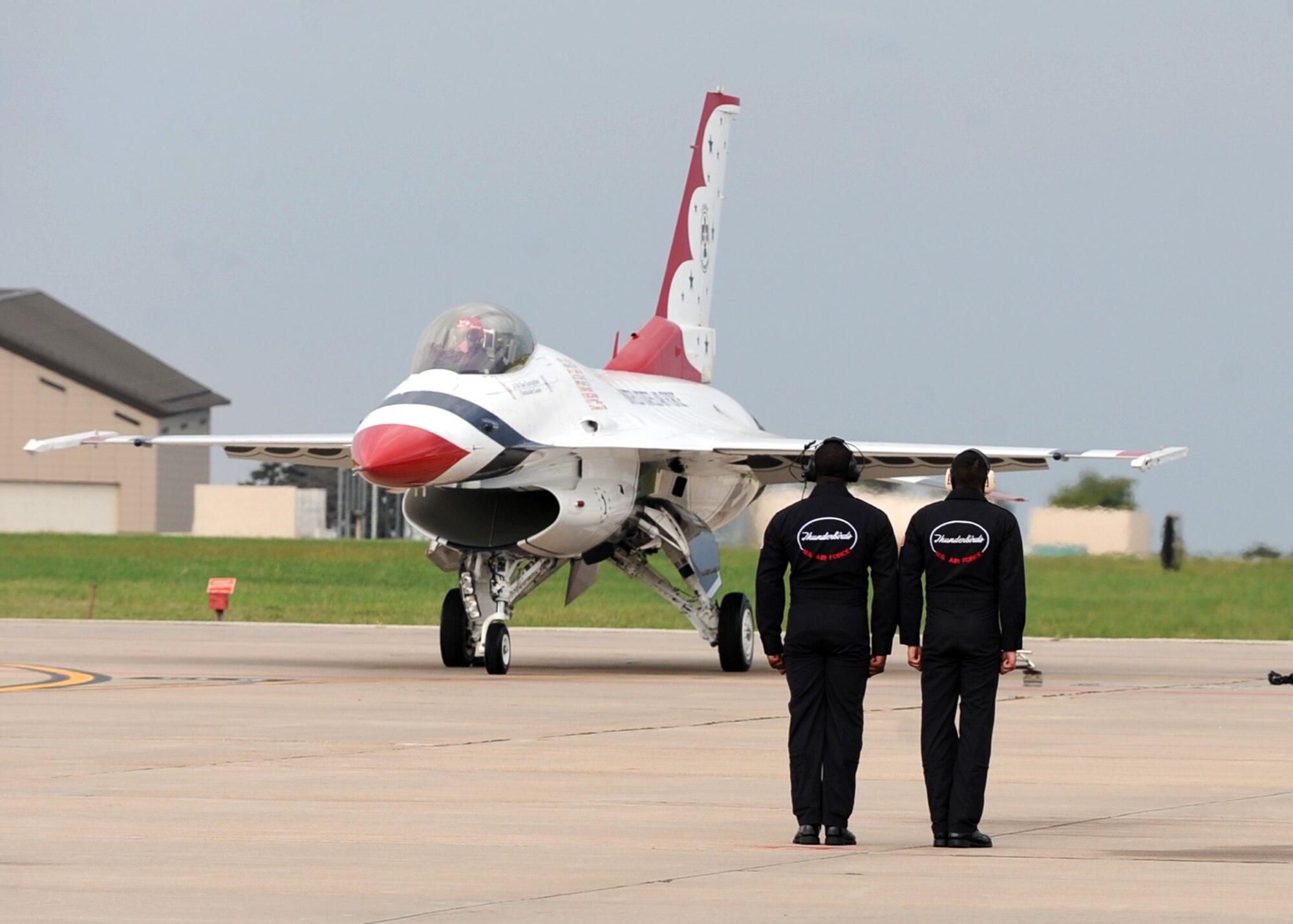 Ground crew members of Thunderbirds, the U.S. Air Force Air Demonstration Squadron, stand by to launch Lt. Col. Case Cunningham’s aircraft before a performance at McConnell’s 2010 Open House and Air Show, Sept. 25, 2010, McConnell Air Force Base, Kan.  Colonel Cunningham is the U.S. Air Force Air Demonstration Squadron Thunderbirds commander and he flies “Thunderbird 1.”  (U.S. Air Force photo/Staff Sgt. Dallas Edwards)