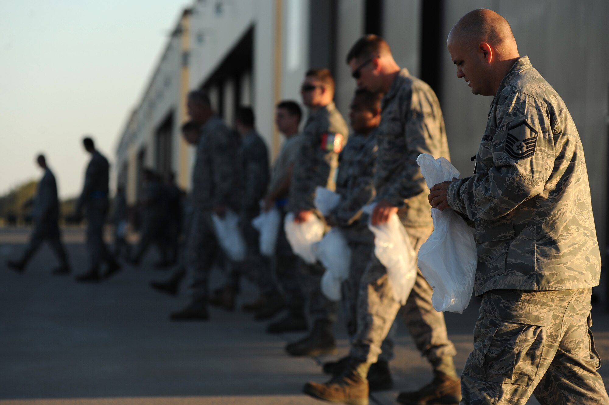WHITEMAN AIR FORCE BASE, Mo. -- Maintainers and crew chiefs with the 509th Maintenance Squadron and 131st Bomb Wing prepare to perform a Foreign Object Debris walk before starting their day, Sept. 28, 2010. FOD mishaps can potentially result in extensive aircraft damage, ultimately hindering the Air Force's flying mission. To counter such events, crew chiefs, maintainers and other personnel working on the flightline take responsibility for eliminating FOD to keep the aircraft safe and the flying mission soaring. (U.S. Air Force photo by Senior Airman Kenny Holston)(Released) 


