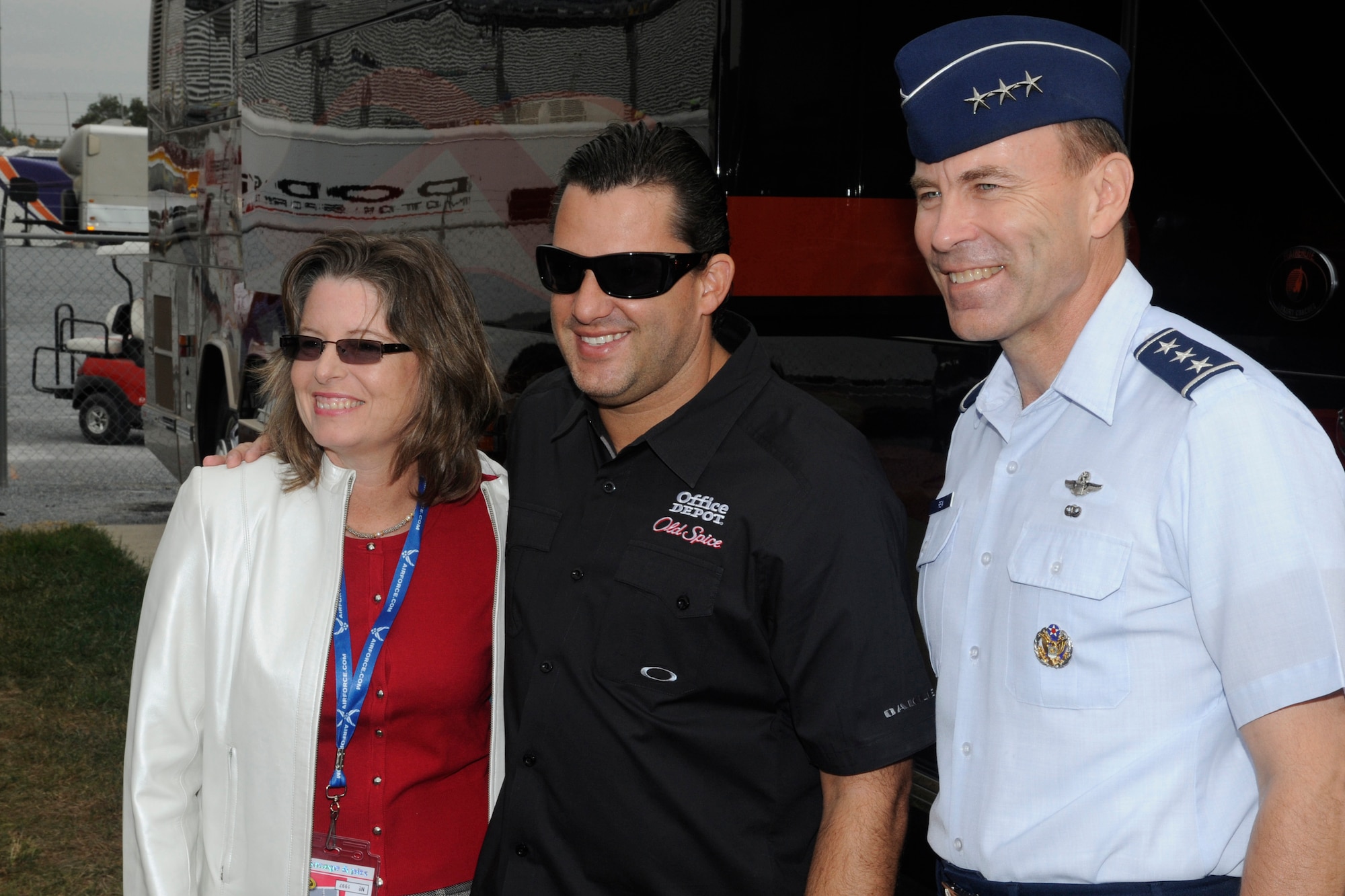 U.S. Air Force Lt. Gen. William Rew and his wife Cindy pose for a photo with NASCAR Sprint Cup driver Tony Stewart before the start of the AAA 400 race at Dover International Speedway, Dover, Del., Sept. 26, 2010. (U.S. Air Force photo by John Sidoriak/Released)
