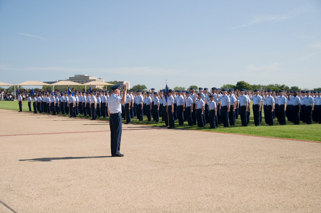 The administration of the Oath of Enlistment officially indoctrinates the newest Air Force Enlisted members at the Parade Ceremony. (U.S. Air Force Photo/Melinda Mueller)
