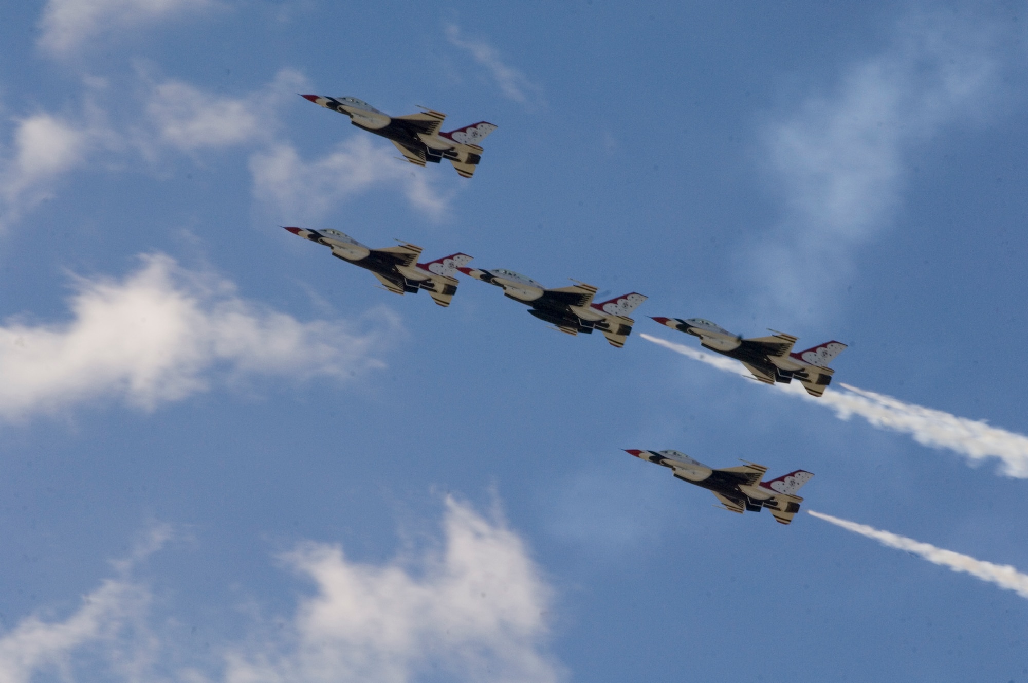 Five of the Thunderbirds F-16 Fighting Falcons, perform a five-card loop during McConnell’s 2010 Open House and Air Show Sept. 26, 2010, McConnell Air Force Base, Kan.  The USAFADS performs no more than 88 air demonstrations each year, and has never canceled a demonstration due to maintenance difficulty.  (U.S. Air Force photo/Senior Airman Abigail Klein)