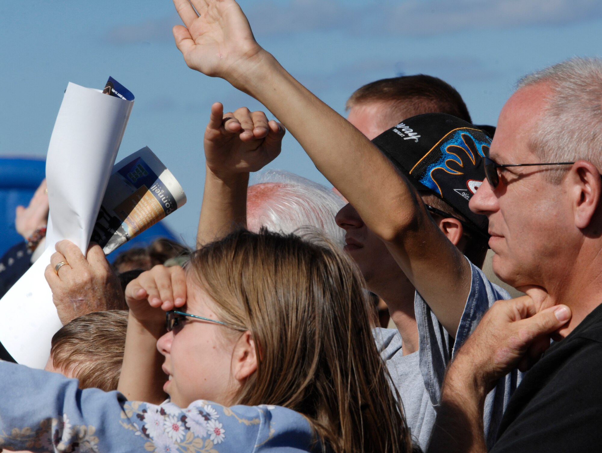 Members of the community observe the Thunderbirds, the U.S. Air Force Air Demonstration Squadron, as they perform aerial demonstrations at the 2010 Open House and Air Show Sept. 26, 2010.  More than 100,000 guests attended the two-day open house.  (U.S. Air Force photo/Senior Airman Abigail Klein)