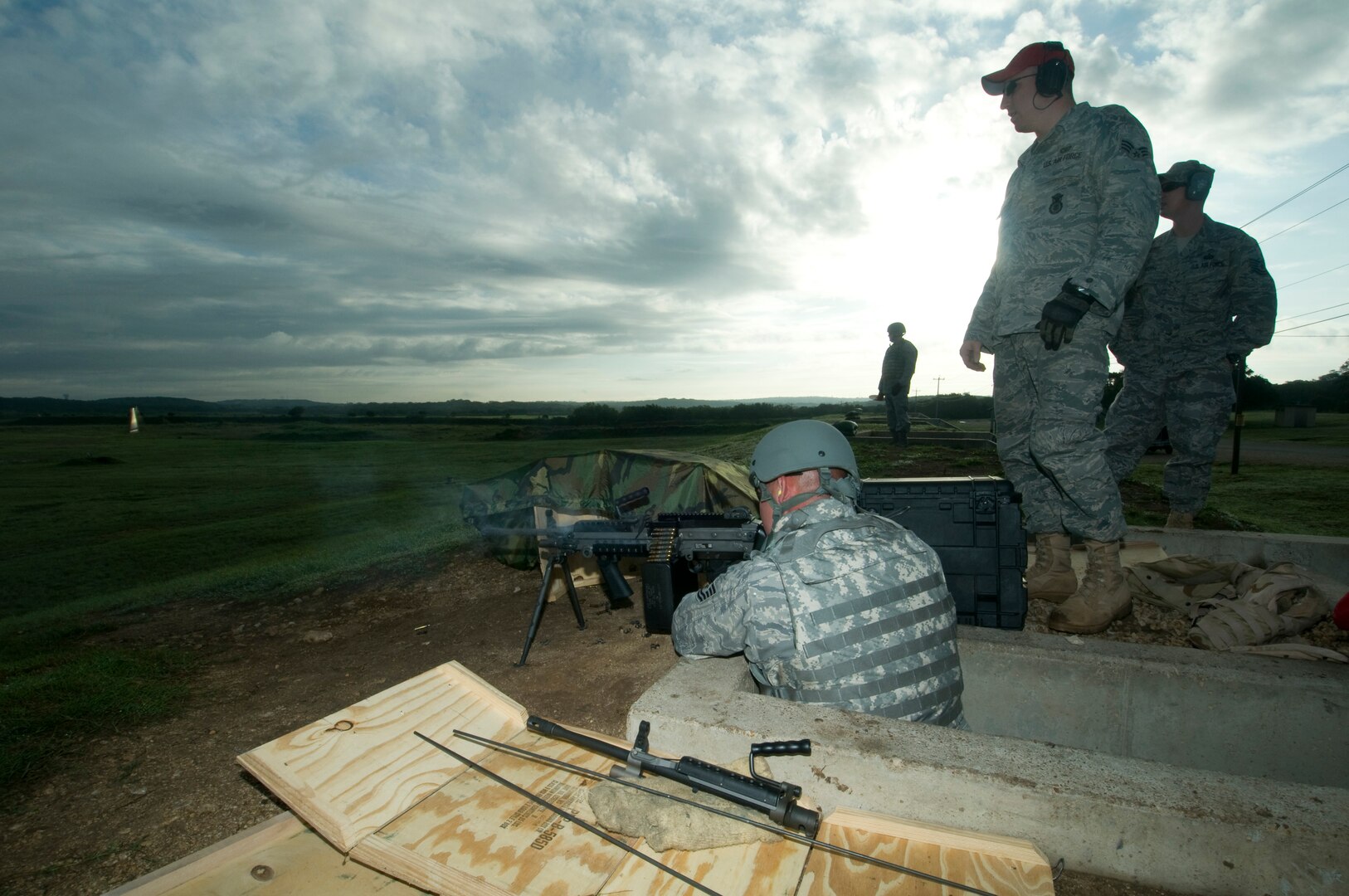 Getting an early start, airman assigned to the 902 ABW/SFS start heavy weapons qualification firing at Camp Bullis, TX 21 September 2010. (U.S. Air Force photo/Steve White)