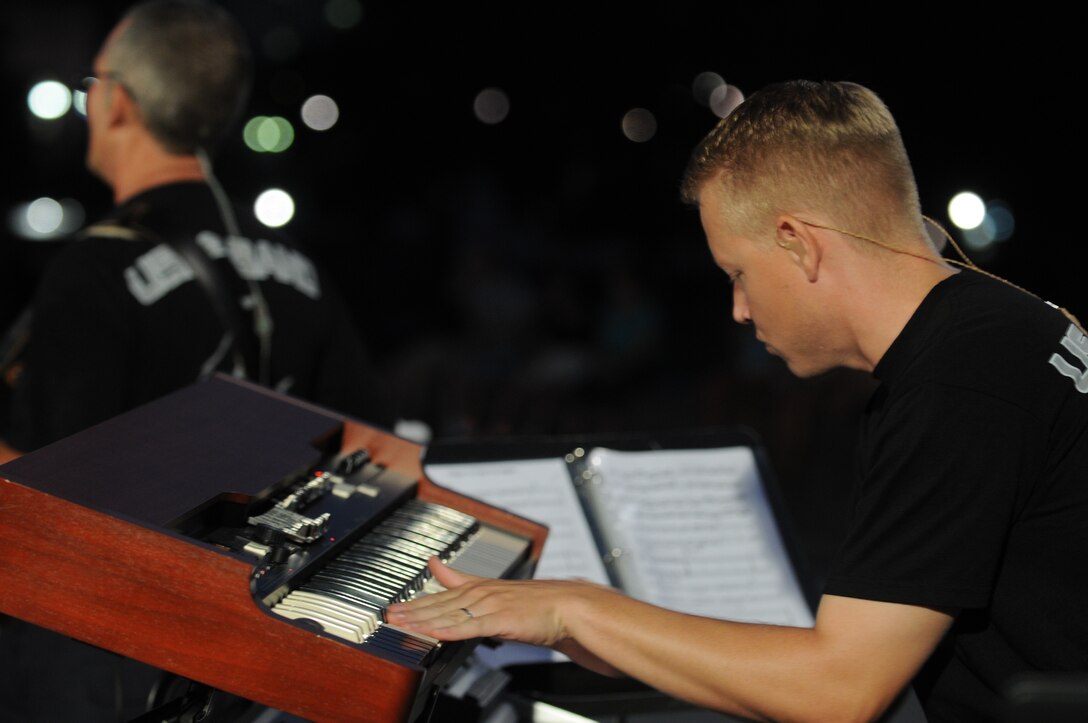 Tech. Sgt. Jonathan McPherson performs with Max Impact during a Summer Concert on August 25, 2008.  (US Air Force Photo)