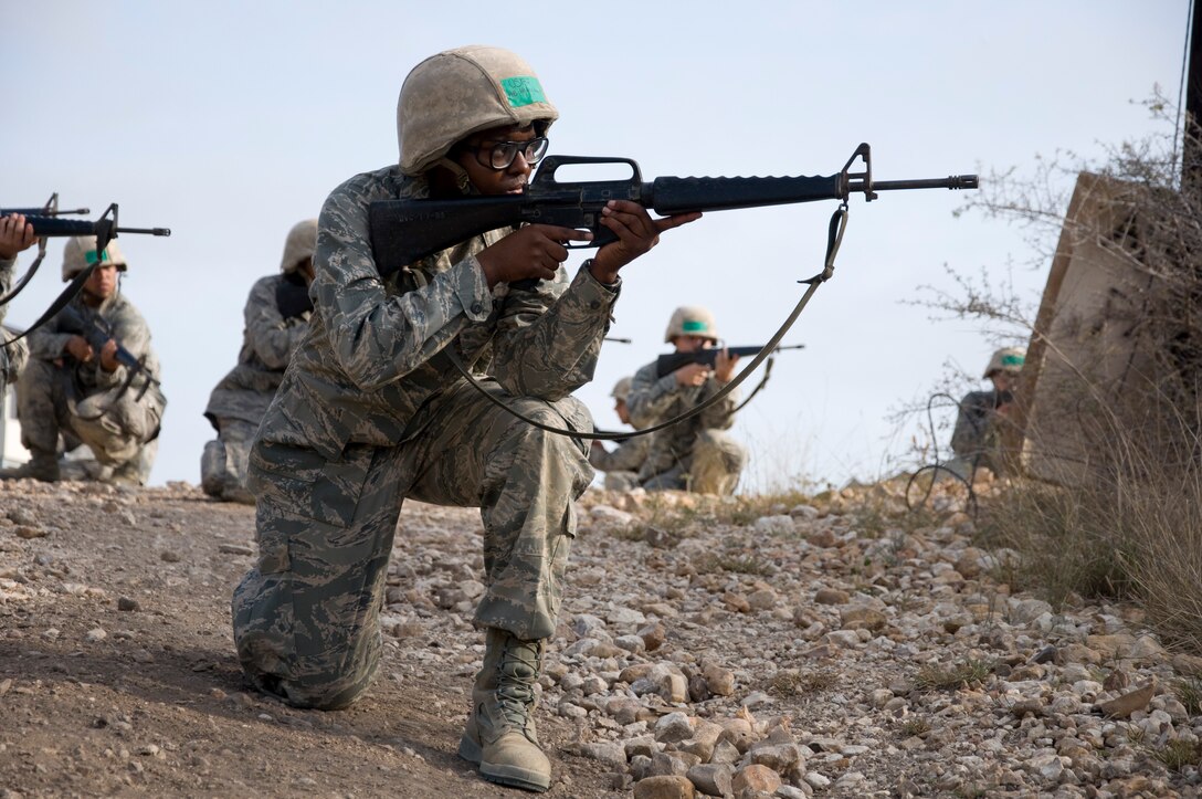 Trainees provide security for their team during the Tactical Drill Mission at BEAST. (U.S. Air Force Photo/Melinda Mueller)
