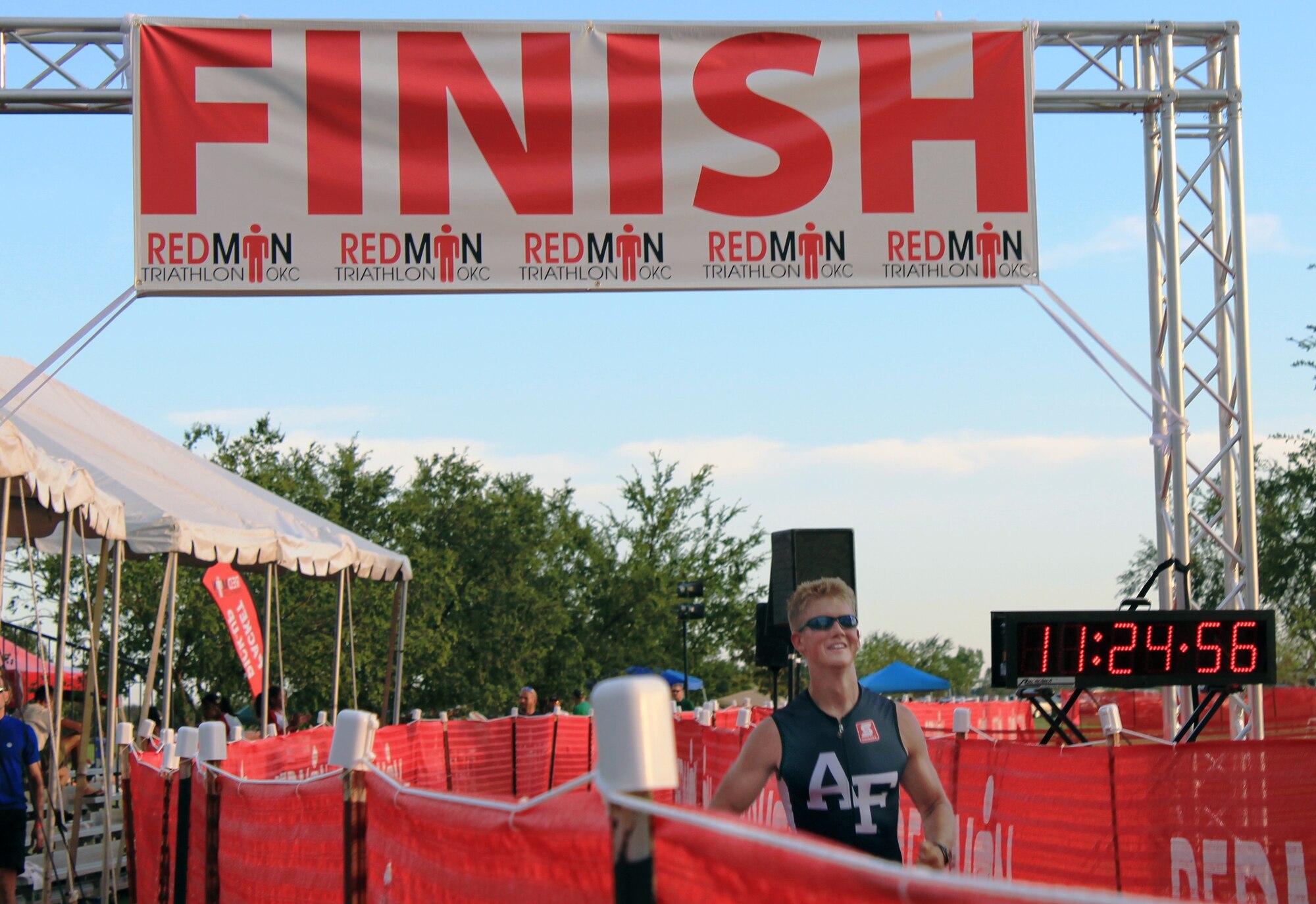 Cadet 2nd Class Nathan Betcher crosses the finish line Saturday, Sept. 25, 2010 during the Redman Triathlon in Oklahoma City.  Betcher and two other cadets raced in the event representing the Air Force Academy Triathlon Club. (Courtesy Photo)