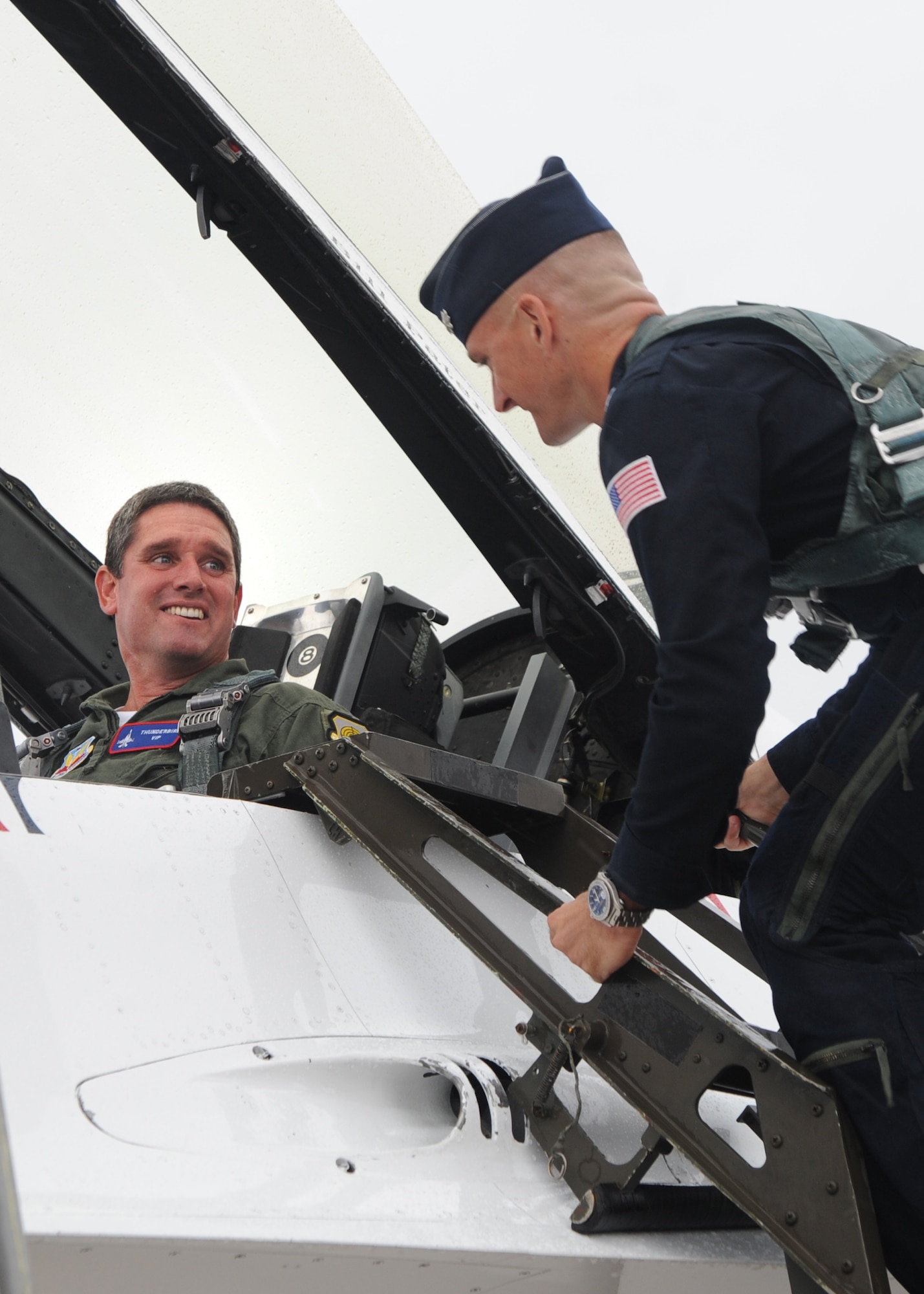 Lt. Col. Derek Routt,  U.S. Air Force Thunderbird Air Demonstration Squadron operations officer , who flies the No. 7 jet prepares Bill Pater, a 23-year firefighter veteran from Derby, Kan.,  for his  “Hometown Hero” flight inside an F-16 fighter aircraft Sept. 23, 2010, McConnell Air Force Base, Kan.  Mr. Pater was selected as the “Hometown Hero” for his passion to serve and his commitment to the Derby Community.  The "Hometown Hero" orientation flight with the Thunderbirds is a way to showcase Americans doing amazing things in their community.  (U.S. Air Force photo/Airman 1st Class Andrea Salazar)