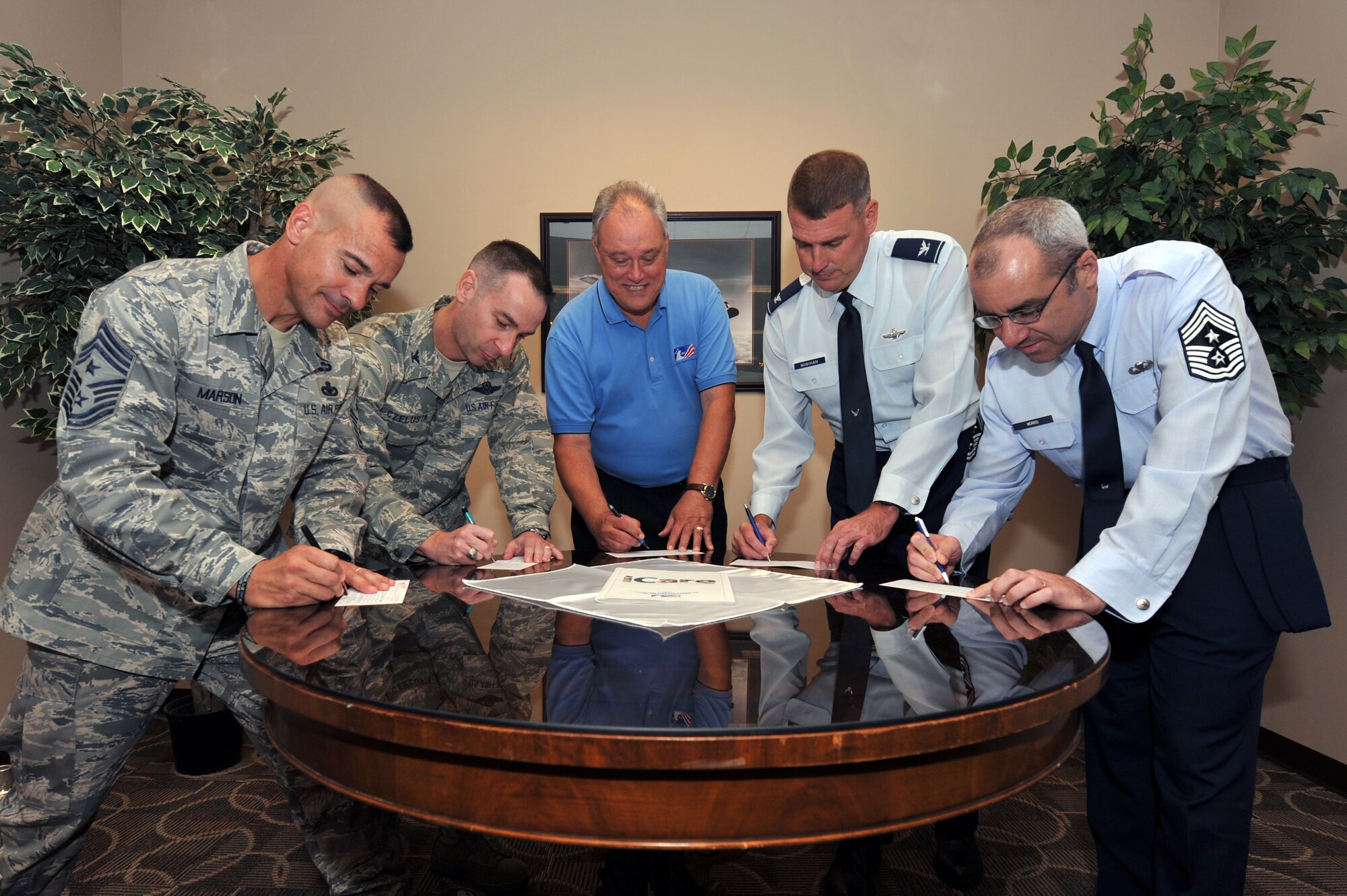 (From left) Chief Master Sgt Mark Marson, 314th Airlift Wing command chief; Col. Mark Czelusta, 314th AW commander; B. J. Bowen, Combined Federal Campaign of greater Arkansas; Col. Mike Minihan, 19th Airlift Wing commander; and Chief Master Sgt. James Morris, 19th AW command chief; sign forms Sept. 29 to donate to the Combined Federal Campaign.  The goals for this year’s campaign are 100-percent contact, 50-percent participation and $250,000 raised. (U.S. Air Force photo by Chris Willis)