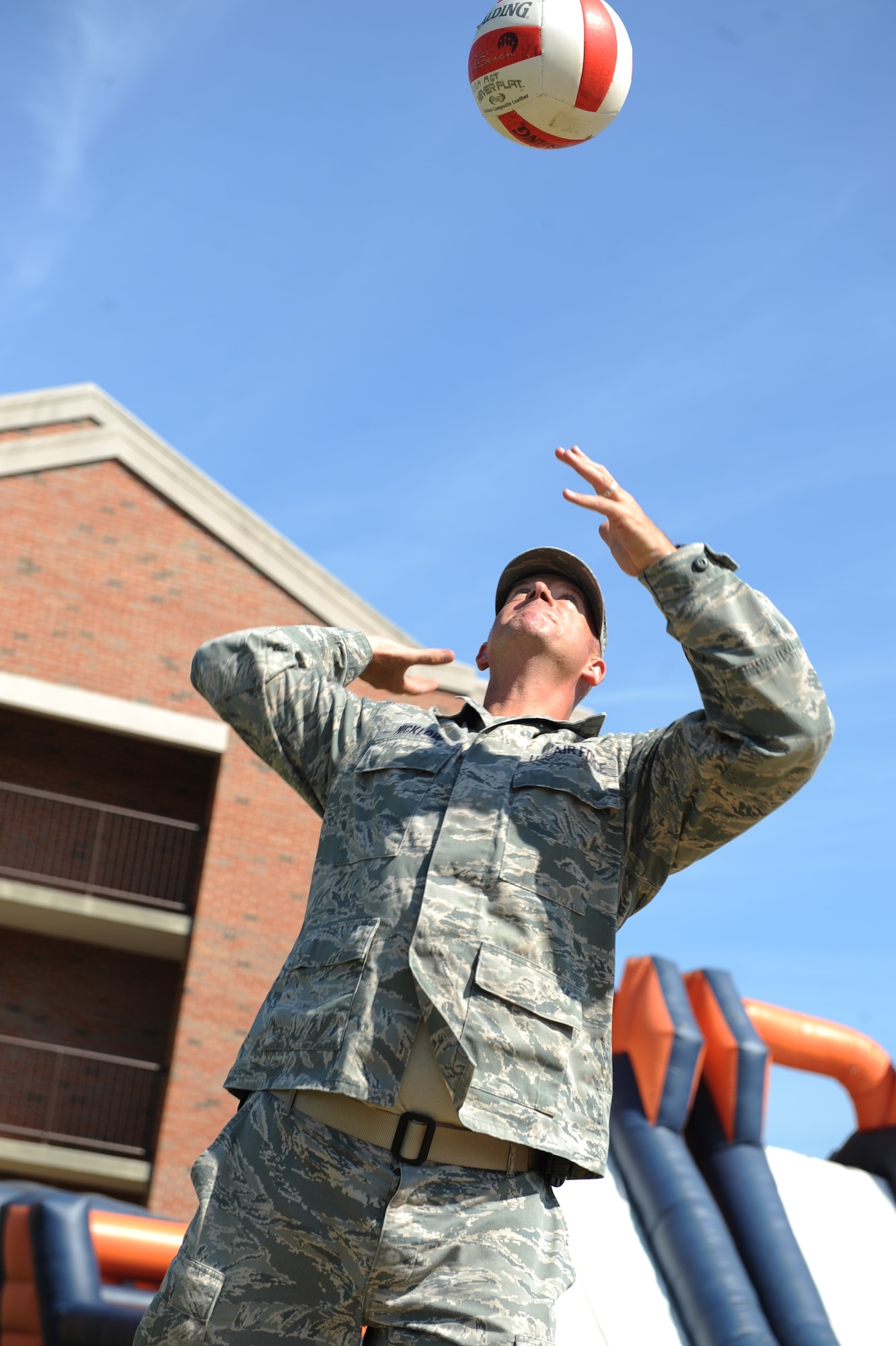 SCOTT AIR FORCE BASE, Ill. -- Master Sgt. Michael Nicklow, 375th Civil Engineer Squadron, serves the ball during a game of volleyball at the Suicide Prevention Field Day Sept. 23. Airmen had the chance to relax and socialize for the afternoon with lunch provided by the USO and a bit of friendly competition. (U.S. Air Force Photo/Senior Airman Tristin English)