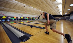 Master Sgt. Pete Scheidt takes careful aim as he throws his bowling ball down his lane during a competition for the Commanders Cup at Marrington Lanes located on the Naval Weapons Station Sept. 28, 2010. The competition began Sept. 17 and is open to all Department of Defense employees and Joint Base Charleston members. Those who are participating were broken down into five teams who must partake in numerous sporting events including golf, basketball, and a combined relay. Whichever team has accrued the most points throughout the events will be awarded the Commanders Cup on Oct. 1. Sergeant Scheidt is a loadmaster with the 14th Airlift Squadron. (U.S. Air Force Photo/Airman 1st Class Lauren Main)