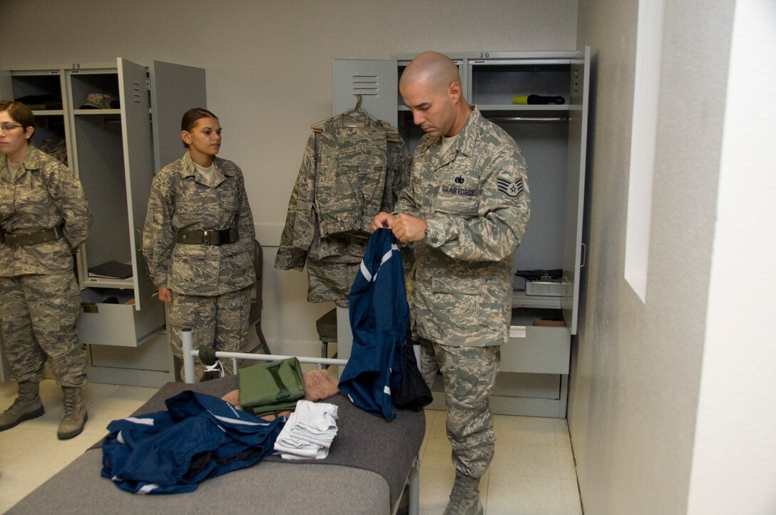 After all of the personal items have been properly marked, folded and placed, Military Training Instructors conduct “stand-by” inspections of the personal areas and document any discrepancies found. (U.S. Air Force Photo/Melinda Mueller)