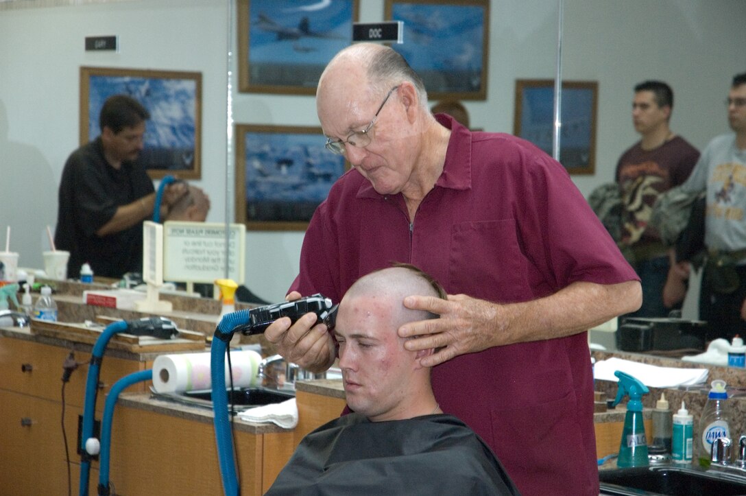 The famous “Clipper Cuts” of Lackland Air Force Base.  This barber has been clipping hair here for almost 50 years. (U.S. Air Force Photo/Training Development Flight)
