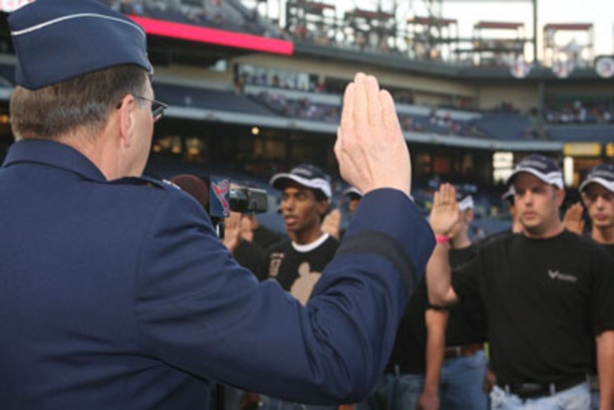Atlanta Braves fans witnessed a military tradition as Air Force Reserve Members from Dobbins Air Reserve Base were sworn in by Lt. Gen. Charles E. Stenner Jr., commander AFRC, for both a continuation of their enlistment and those joining for the first time at a ceremony held at Turner field Stadium Sep 28. (U.S. Air Force Photo/Don Peek)