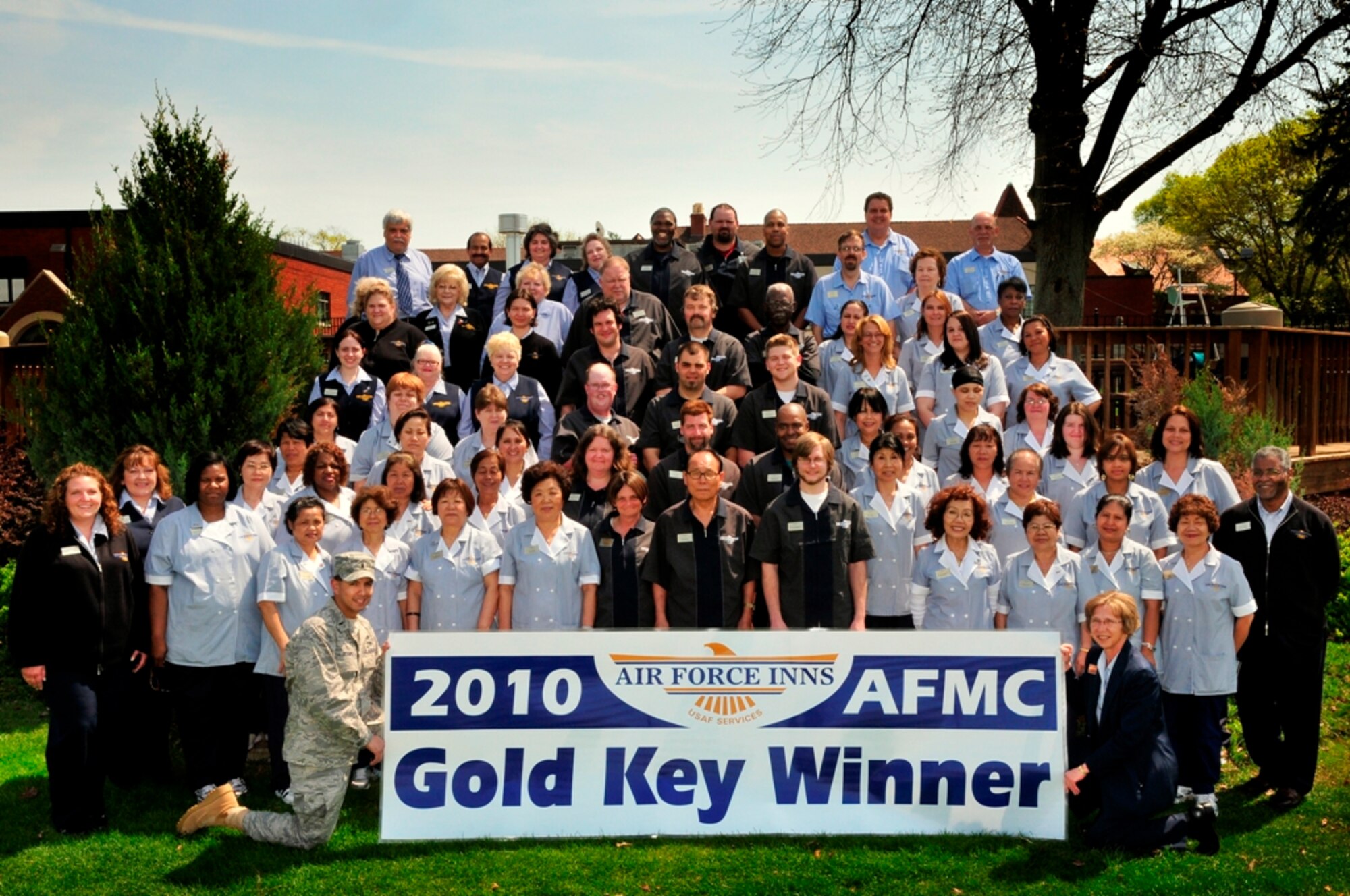 The Wright-Patterson Lodging team settles down for a group photo after winning the Air Force Material Command's "Gold Key" award (U.S. Air Force photo by Ryan P Burger)