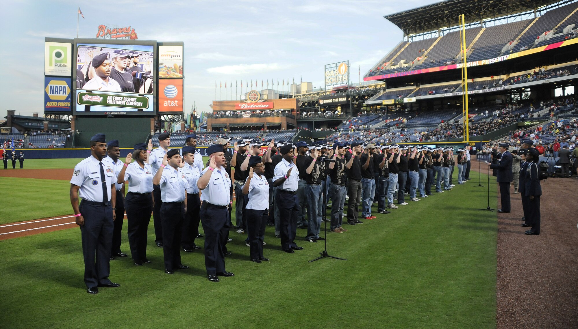 Seventy-nine new Air Force Reserve recruits take the oak of enlistment just prior to the Atlanta Braves' homegame at Turner Field on Sept. 28, 2010. Lt. Gen.  Charles E. Stenner Jr., commander of Air Force Reserve Command, administered the oath. The ceremony included presentation of the colors by the Dobbins Air Reserve Base, Ga., honor guard and a flyover by two C-130 Hercules aircraft from the base. The Braves beat the Florida Marlins 3-2. (U.S. Air Force photo/Tech. Sgt. Paul Flipse)
