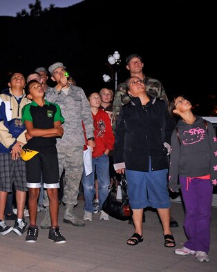 Cadet 3rd Class Trey Cottingham uses a green laser to point out stars and constellations in the early autumn sky to Falcon Middle School students visiting the Air Force Academy observatory Sept. 24, 2010. Students also toured Department of Physics classrooms and learned about the 61-cm telescope used to conduct astronomy research at the Academy. (U.S. Air Force photo/Mike Kaplan)