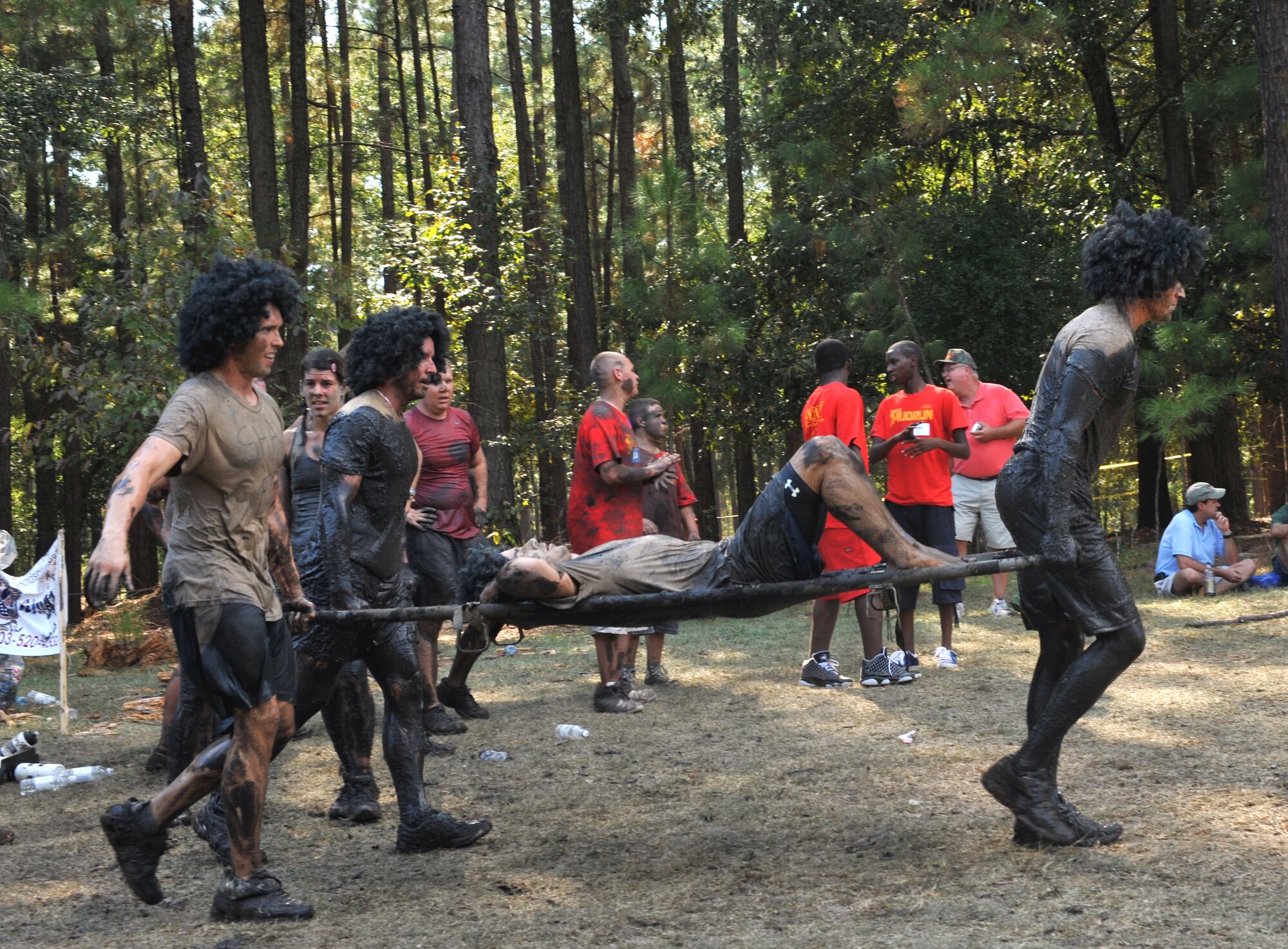 100925-F-4406D-127 SHAW AIR FORCE BASE, S.C.- As the last obstacle of the 17th Annual Mud Run, a team carries a member of their team on the "Stretcher Carry" in Gaston, S.C., Sept. 25, 2010. The USMC Mud Run is held annually to raise money for marines and their families who have been killed on duty. Its profits also go towards scholarships and local events which promote the Marine Corps in the community. (U.S. Air Force photo/Airman 1st Class Tabatha L. Duarte (Released)