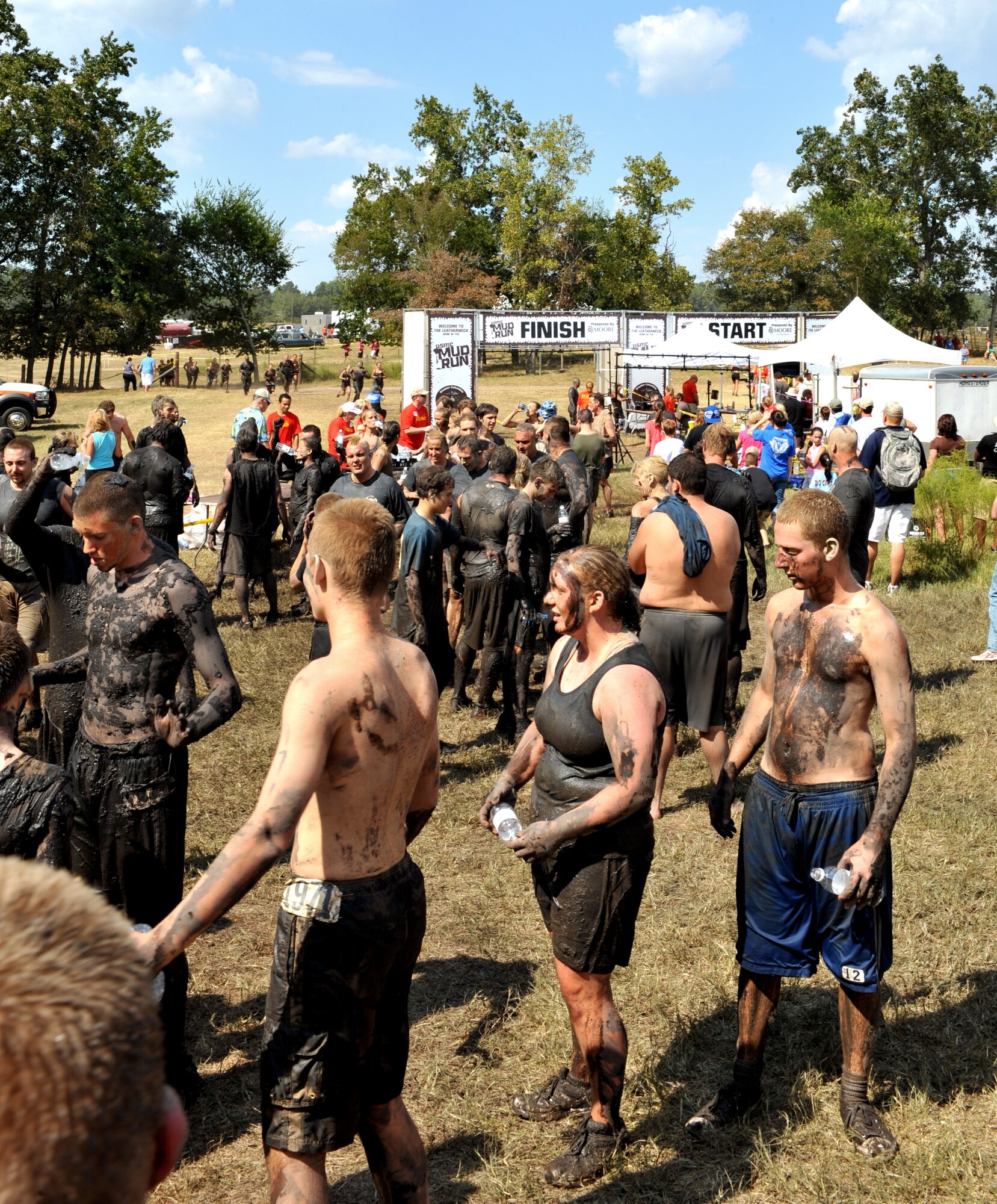 100925-F-4406D-047 SHAW AIR FORCE BASE, S.C.- A group of contestants rest after finishing the 4.2 mile obstacle course at the 17th Annual United States Marine Corps Mud Run in Gaston, S.C., Sept. 25, 2010. The USMC Mud Run is held annually to raise money for Marines and their families who have been killed on duty. Its profits also go towards scholarships and local events which promote the Marine Corps in the community. (U.S. Air Force photo/Airman 1st Class Tabatha L. Duarte (Released)