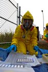 MINOT AIR FORCE BASE, N.D. – Tech. Sgt. Krista Moreau, 5th Medical Operations Squadron bioenvironmental response team member, observes hand held assay kits during an exercise here Sept. 23. The hand held assay kits are only used when there is suspected biological contamination. Exercises like these are vital training tools used throughout the year to ensure wing personnel are trained to provide safe, secure, effective conventional and nuclear operations as mandated by Air Force Global Strike Command. (U.S. Air Force photo by Master Sgt. Michael Gaddis)