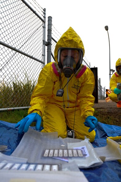 MINOT AIR FORCE BASE, N.D. – Tech. Sgt. Krista Moreau, 5th Medical Operations Squadron bioenvironmental response team member, observes hand held assay kits during an exercise here Sept. 23. The hand held assay kits are only used when there is suspected biological contamination. Exercises like these are vital training tools used throughout the year to ensure wing personnel are trained to provide safe, secure, effective conventional and nuclear operations as mandated by Air Force Global Strike Command. (U.S. Air Force photo by Master Sgt. Michael Gaddis)