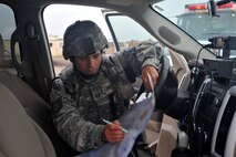 MINOT AIR FORCE BASE, N.D. – Tech. Sgt. Todd Hebert, 5th Security Forces Squadron area supervisor, marks the position of the 5th Civil Engineer Squadron Fire Department decontamination team on a base map during an exercise here Sept. 23. Exercises like these are vital training tools used throughout the year to ensure wing personnel are trained to provide safe, secure, effective conventional and nuclear operations as mandated by Air Force Global Strike Command. (U.S. Air Force photo by Master Sgt. Michael Gaddis)