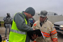 MINOT AIR FORCE BASE, N.D. – Exercise Evaluation Team member, Tech. Sgt. Jay Moreau (left), 5th Civil Engineer Squadron readiness and emergency management superintendent, discusses the incident action plan with Tech. Sgt. Paul Lambert (right), 5th CES hazardous materials assistant fire chief, during an exercise here Sept. 23. Exercises like these are vital training tools used throughout the year to ensure wing personnel are trained to provide safe, secure, effective conventional and nuclear operations as mandated by Air Force Global Strike Command. (U.S. Air Force photo by Master Sgt. Michael Gaddis)
