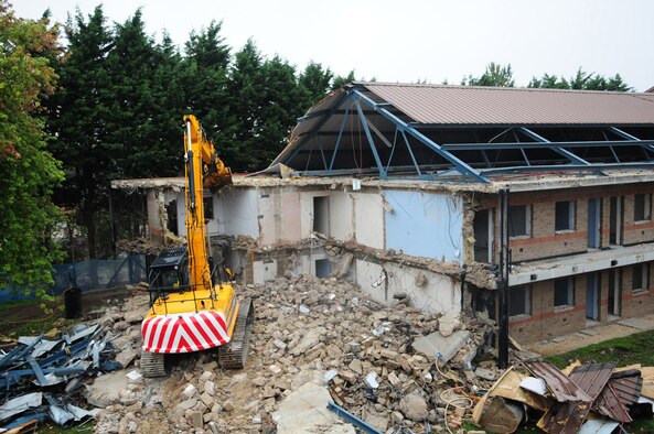 RAF MILDENHALL, England -- Piles of rubble lay where the end of dormitory 212 once stood. The entire building, along with dorm 213, is being demolished and will eventually be replaced with landscaping. (U.S. Air Force photo/Karen Abeyasekere)