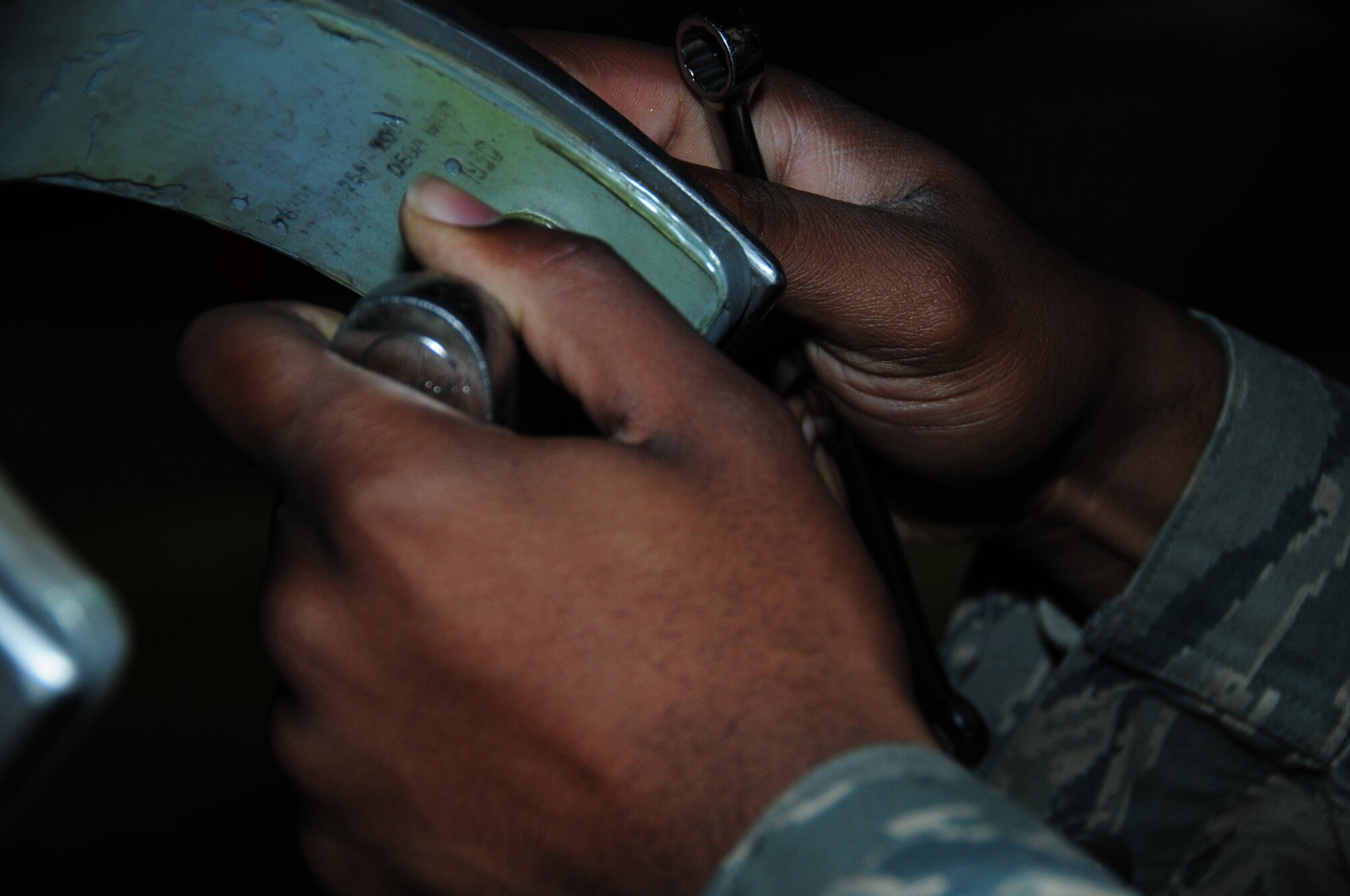 KEFLAVIK, Iceland – Senior Airman Jonathan Ard, 493rd Expeditionary Fighter Squadron Weapons Load Crew team member, loosens a nut in order to remove an unserviceable eagle claw adapter from an F-15C Eagle on Sept. 23. (U.S. Air Force photo/Senior Airman Stephen Linch)