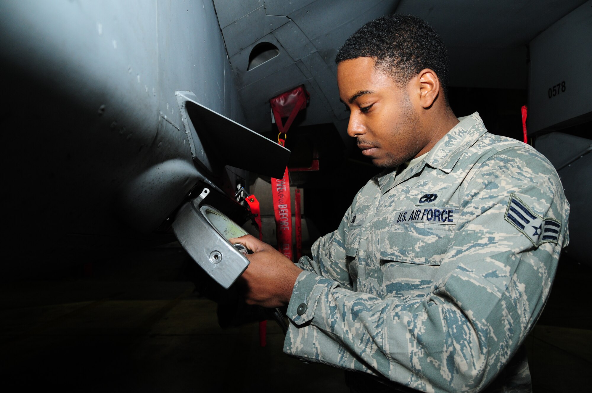KEFLAVIK, Iceland – Senior Airman Jonathan Ard, 493rd Expeditionary Fighter Squadron Weapons Load Crew team member, removes an unserviceable eagle claw adapter from an F-15C Eagle on Sept. 23. Airman Ard is deployed from the 748th Aircraft Maintenance Squadron at RAF Lakenheath, England. (U.S. Air Force photo/Senior Airman Stephen Linch)