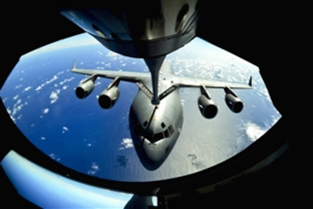 A C-17 Globemaster III gets ready to receive fuel from a KC-135 Stratotanker over the Pacific Ocean, Sept. 18, 2010, The C-17 and KC-135 are participating in a Total Force partnership mission to Andersen Air Base, Guam. The C-17 is assigned to the 15th Wing on Joint Base Pearl Harbor-Hickam, Hawaii, and the KC-135 is assigned to Hawaii Air National Guard's 204th Air Refueling Squadron.