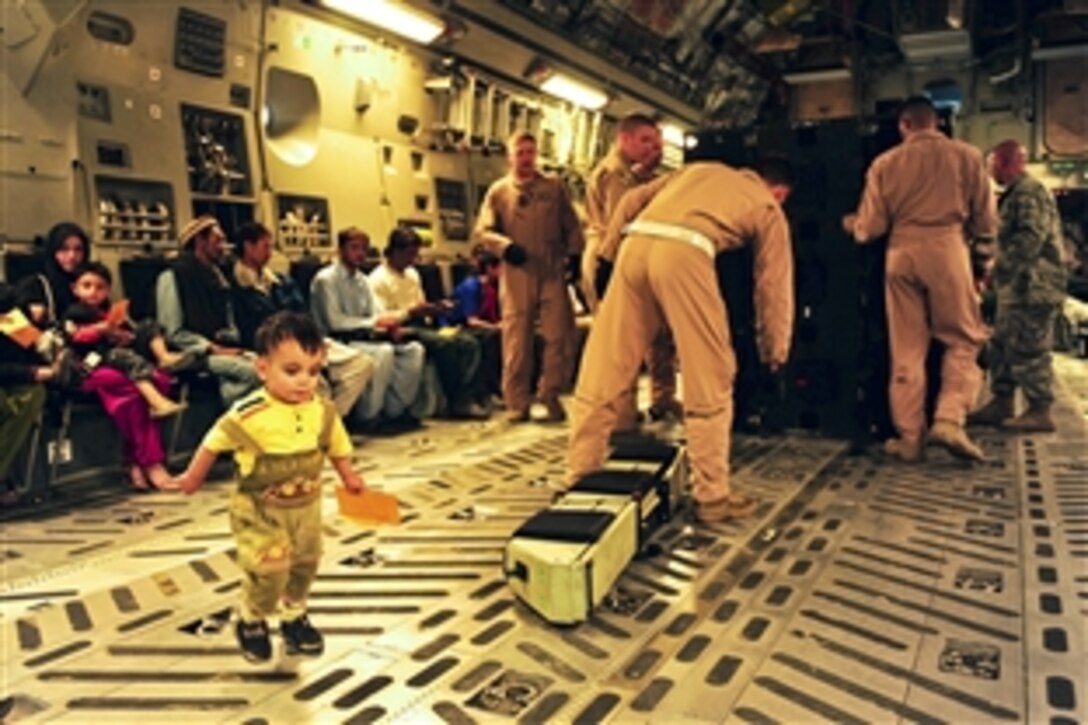 U.S. airmen set up seating in a C-17 Globemaster III aircraft on Skardu Airfield in Pakistan, Sept. 24, 2010. The airman are assigned to the 816th Expeditionary Airlift Squadron, which is conducting missions to deliver humanitarian aid supplies to the region and transport internally displaced persons back to Pakistan Air Force Base Chaklala. 
