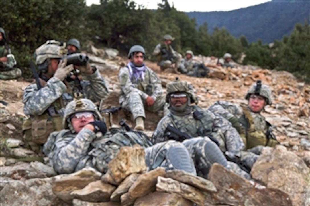 U.S. Army soldiers gain ground security in Masamute Valley as they prepare to cordon and search the village of Bala in Laghman province, Afghanistan, Sept. 25, 2010. The soldiers are assigned to the 1st Battalion, 102nd Infantry Regiment, 86th Brigade Combat Team, Vermont National Guard.